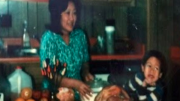 Ben Chestnut as a child with his mother in the kitchen